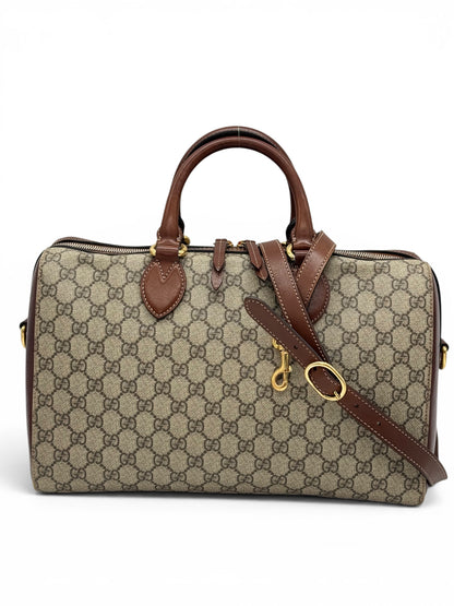 Borsa Gucci GG Supreme marrone in tela monogram con dettagli in pelle e metallo dorato, modello a mano con tracolla regolabile autentica.