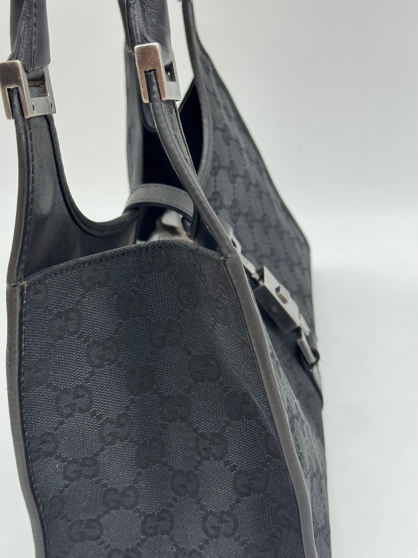 Borsa a spalla Borse Vintage Gucci Jackie in tessuto nero con motivo GG e dettagli in pelle nera