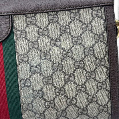 Dettaglio della borsa Borse Vintage Gucci Ophidia in tela GG Supreme con nastro Web e finiture in pelle marrone