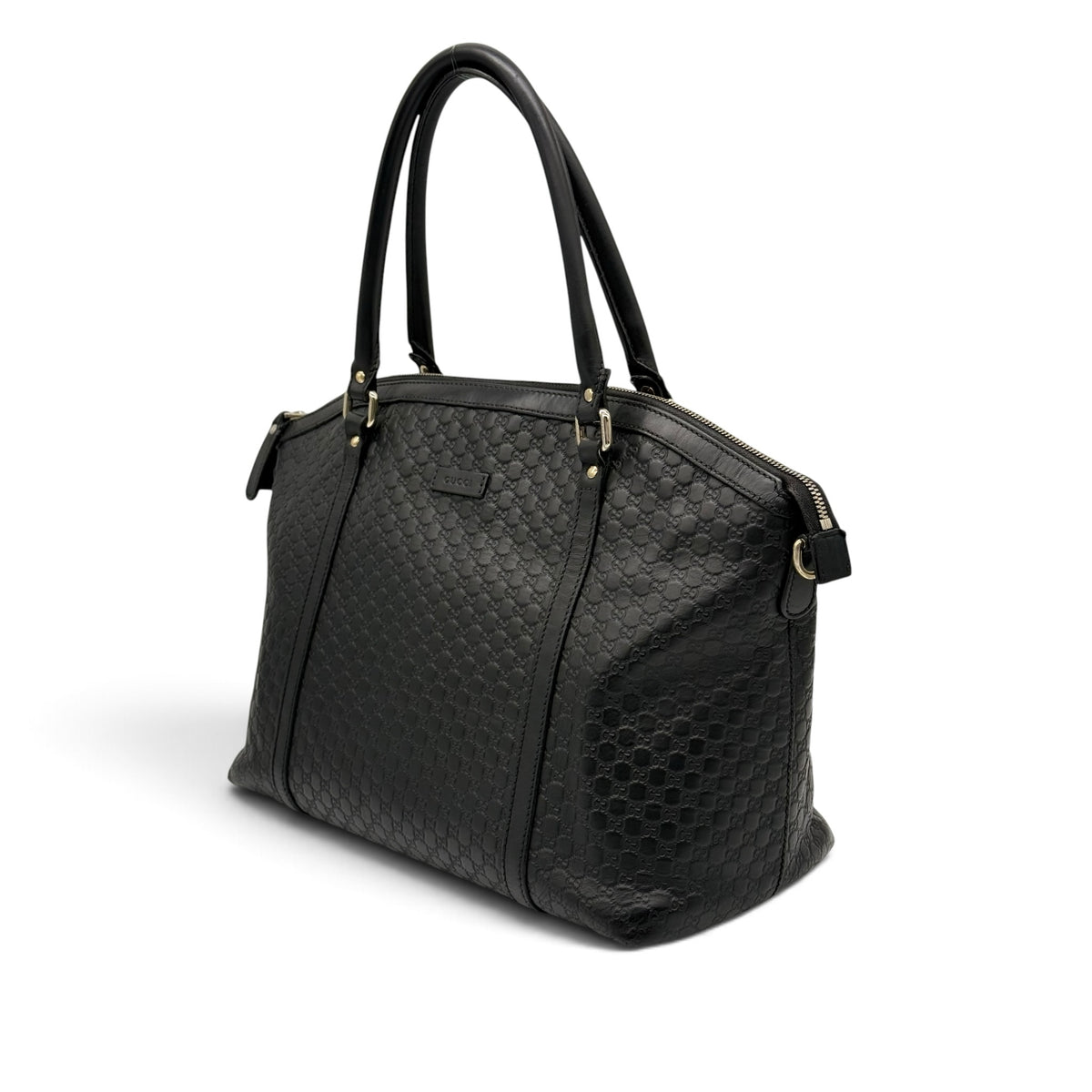Borsa a spalla Borse Vintage Gucci in pelle nera con motivo GG impresso, dettagli dorati e chiusura con zip.