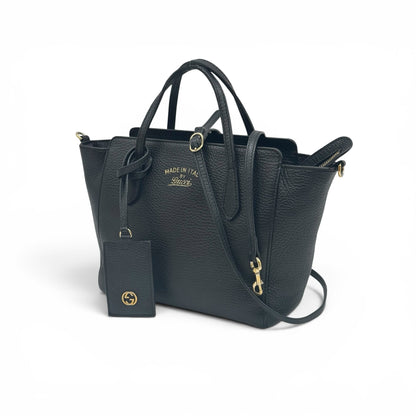 Borsa a mano Borse Vintage Gucci in pelle nera martellata con dettagli dorati, logo GG e tracolla rimovibile.