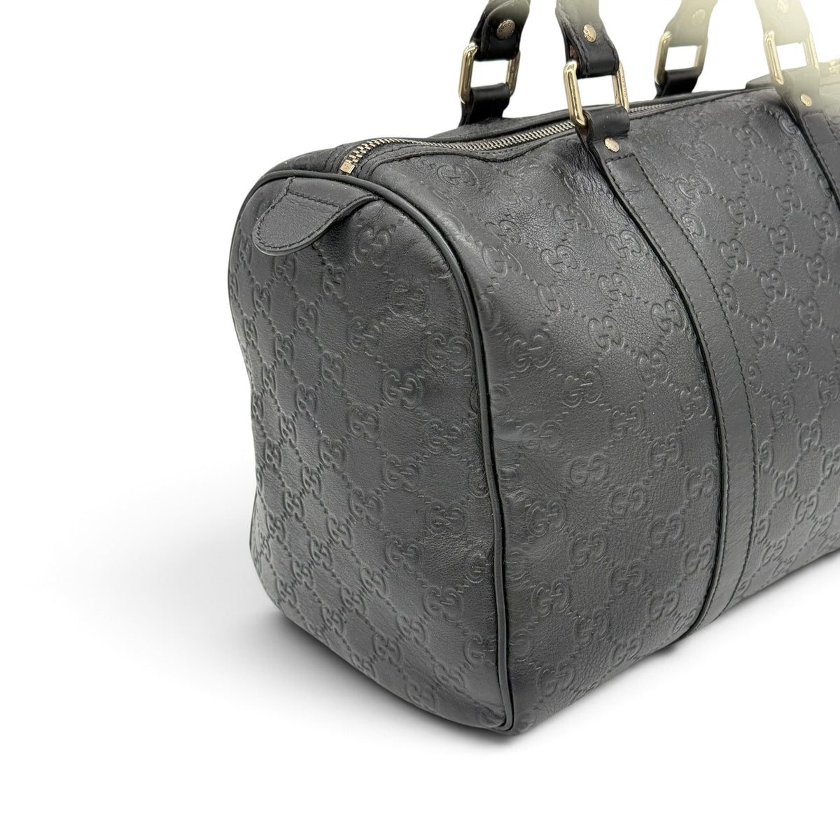 Borsa a mano Borse Vintage Gucci in pelle nera con motivo GG impresso, dettagli dorati e chiusura superiore con zip.
