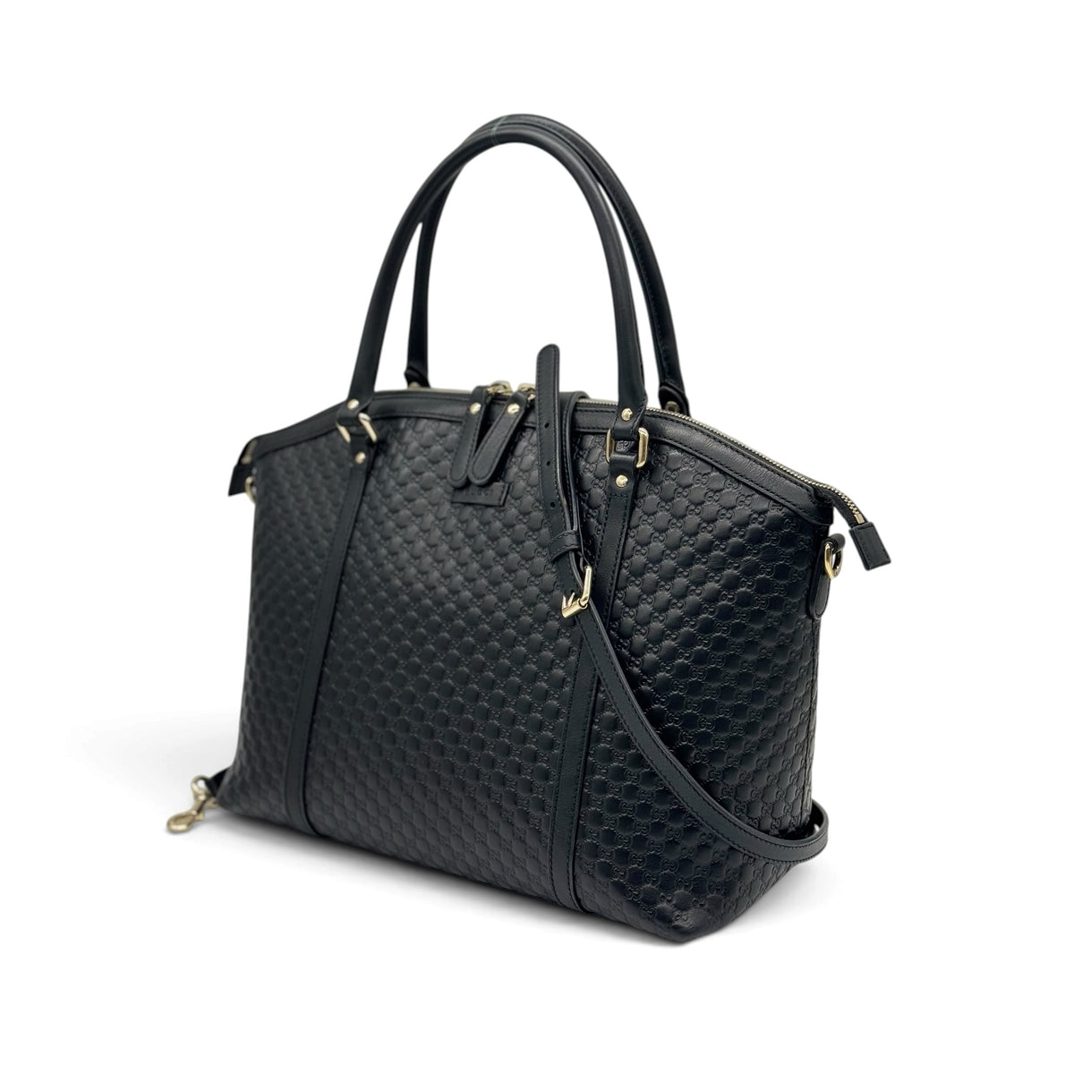 Borsa a mano Borse Vintage Gucci in pelle nera con motivo GG impresso, dettagli dorati e tracolla rimovibile.