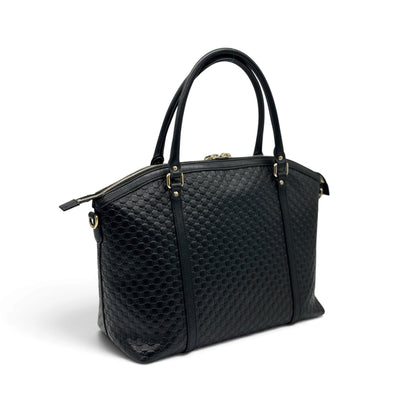 Borsa a mano Borse Vintage Gucci in pelle nera con motivo GG impresso e dettagli in metallo dorato