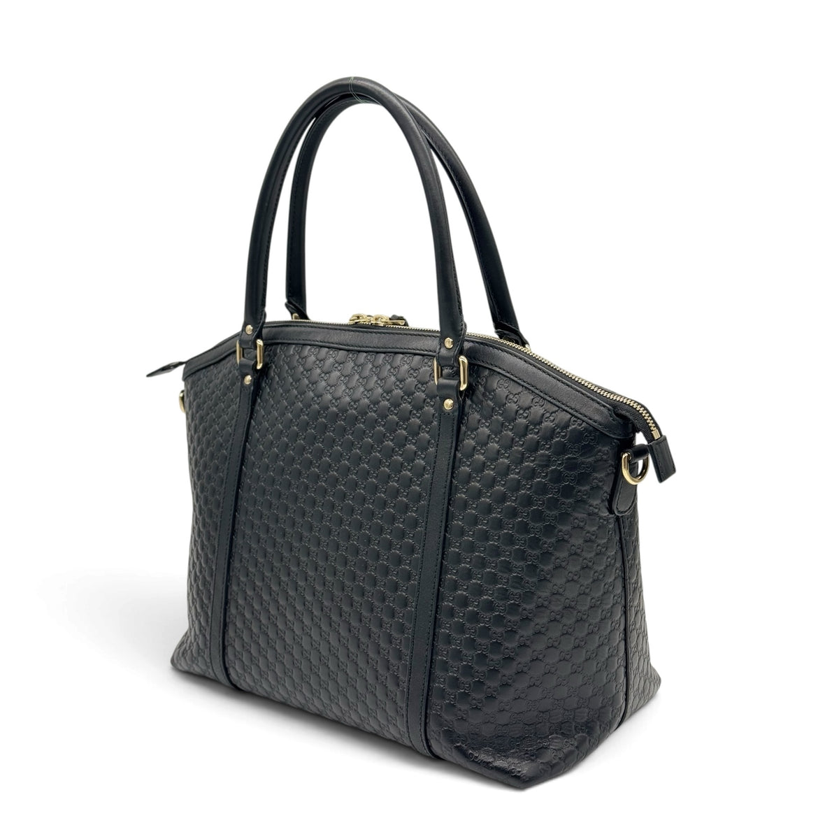 Borsa a mano Borse Vintage Gucci in pelle nera con motivo GG impresso, dettagli oro e doppi manici strutturati.