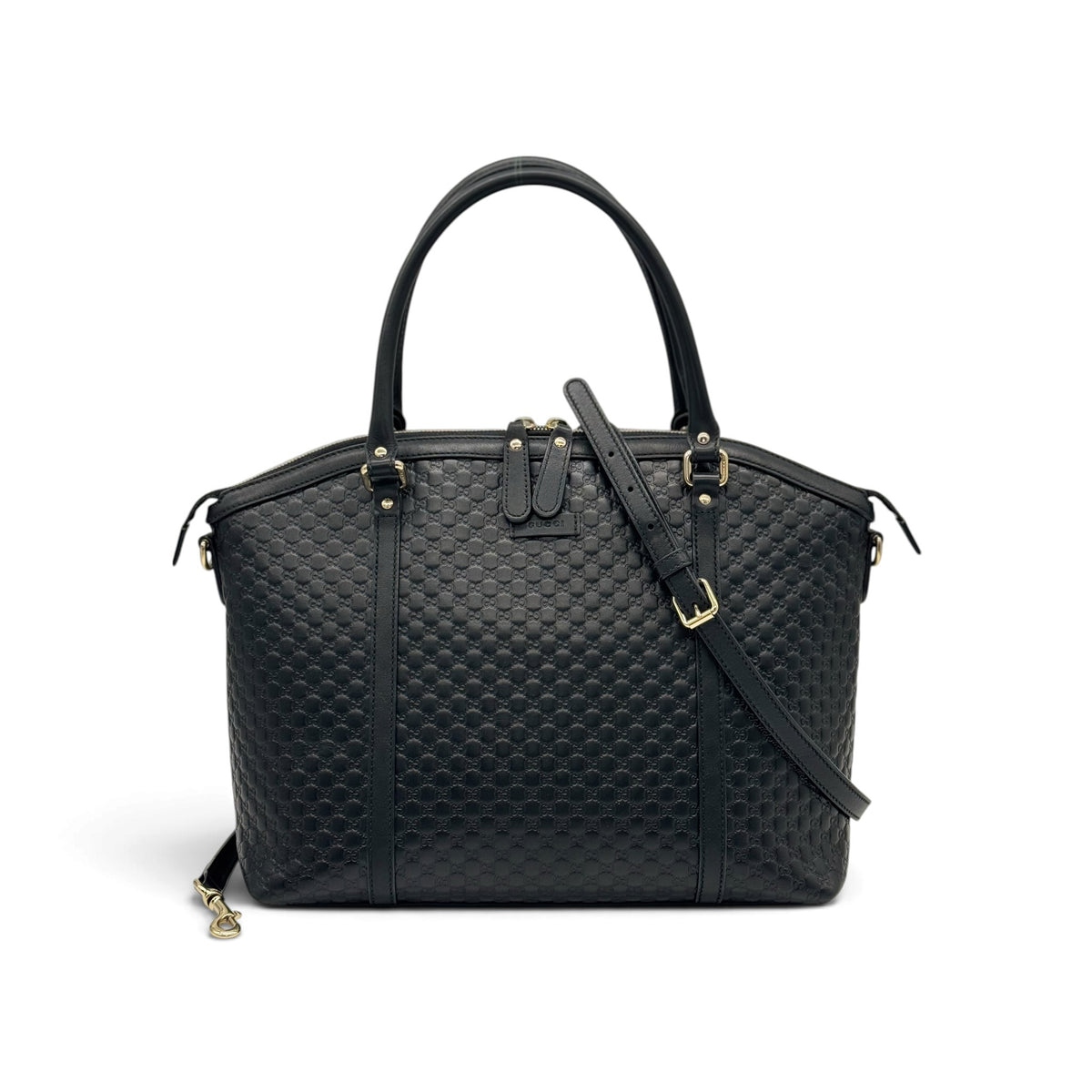 Borsa a mano Borse Vintage Gucci in pelle nera con motivo GG impresso, doppi manici e tracolla rimovibile dorata.