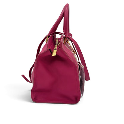 Borsa a mano Borse Vintage Saint Laurent in pelle fucsia con dettagli dorati e tracolla, vista laterale