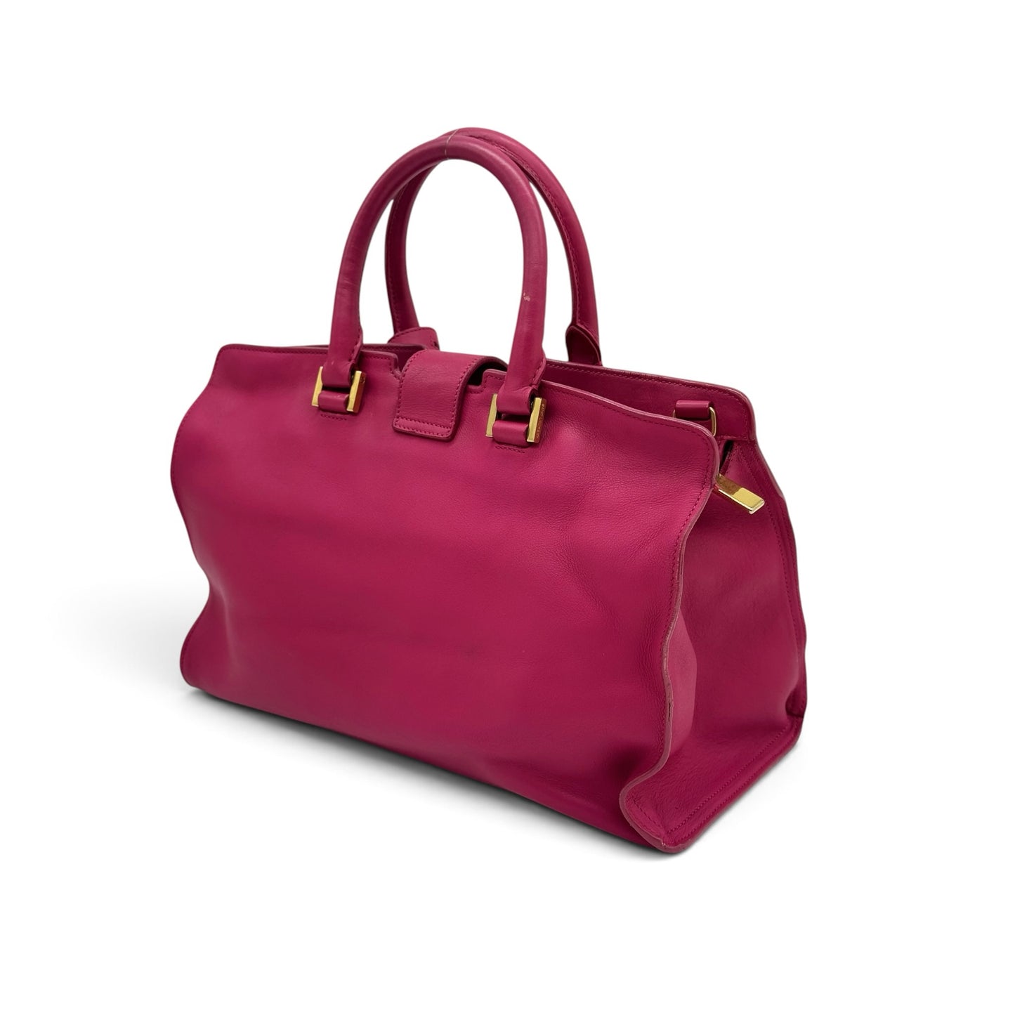 Borsa a mano Borse Vintage Saint Laurent in pelle fucsia con logo dorato e doppi manici, vista di tre quarti.