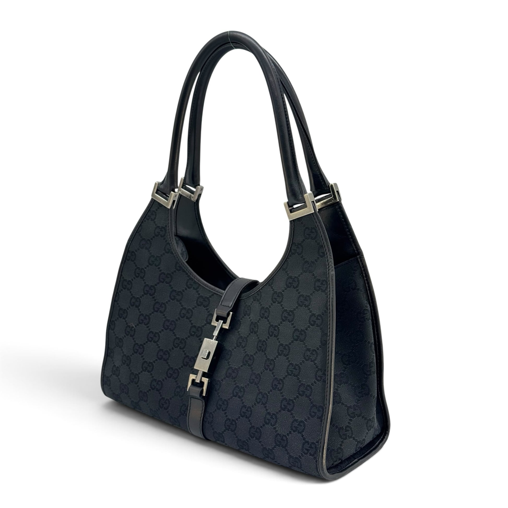 Borsa a spalla Borse Vintage Gucci Jackie in tessuto nero con motivo GG, dettagli in pelle e chiusura metallica iconica
