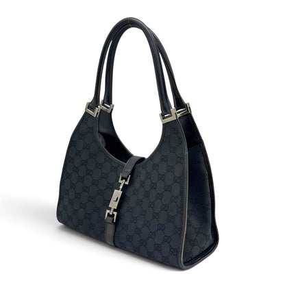 Borsa a spalla Borse Vintage Gucci Jackie in tessuto nero con motivo GG, dettagli in pelle e chiusura metallica iconica