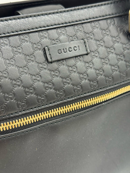 Borsa tote Borse Vintage Gucci in pelle nera con motivo GG impresso e dettaglio zip frontale in metallo dorato