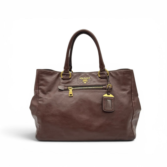 Borsa tote Borse Vintage Prada in pelle marrone con dettagli in metallo dorato, tasca frontale e logo iconico.
