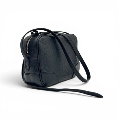 Borsa a tracolla Borse Vintage Gucci in pelle nera con motivo GG impresso e dettagli in metallo dorato