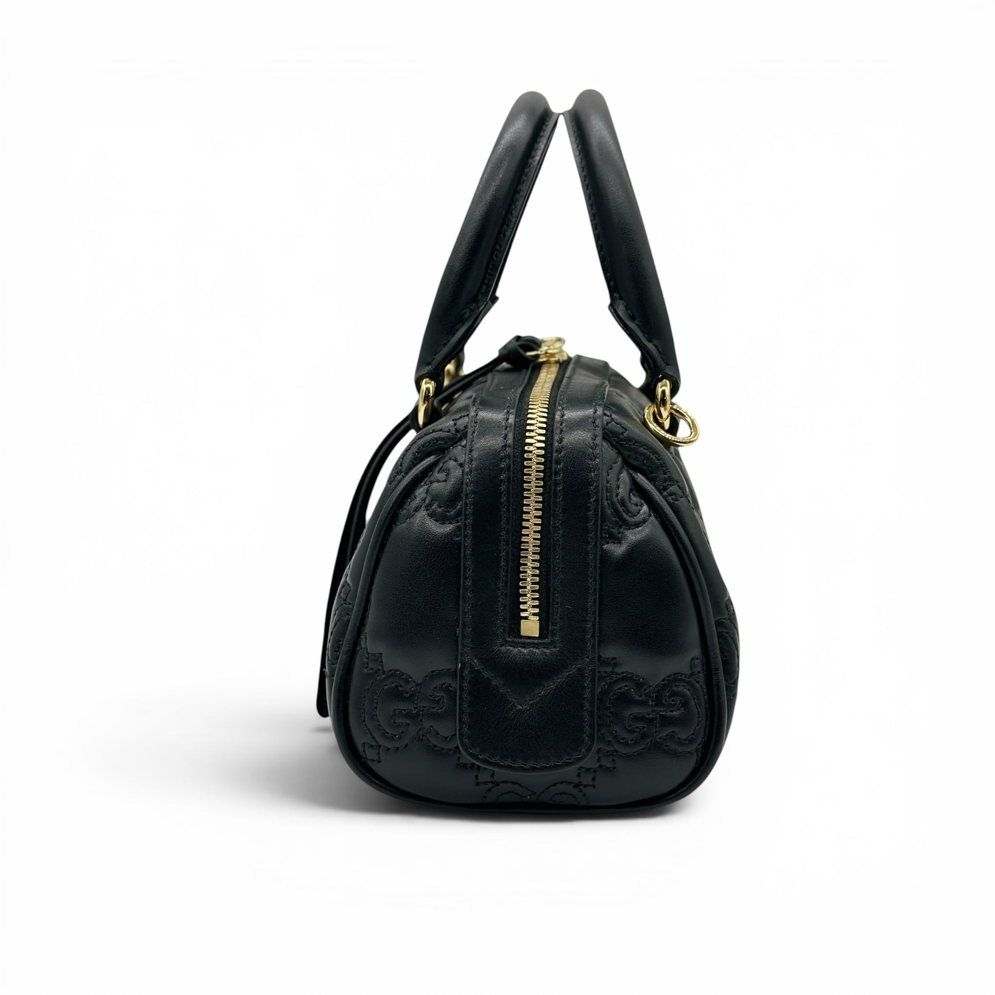 Borsa a mano Borse Vintage Gucci GG Matelassé in pelle nera con dettagli metallici dorati vista di profilo