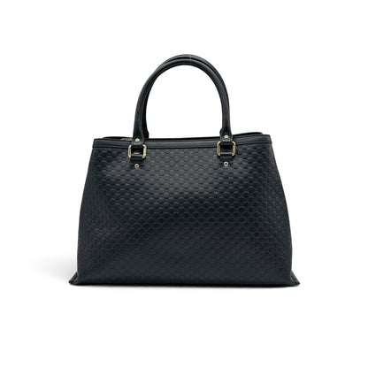 Borsa tote Borse Vintage Gucci in pelle nera con motivo GG impresso e dettagli in metallo dorato