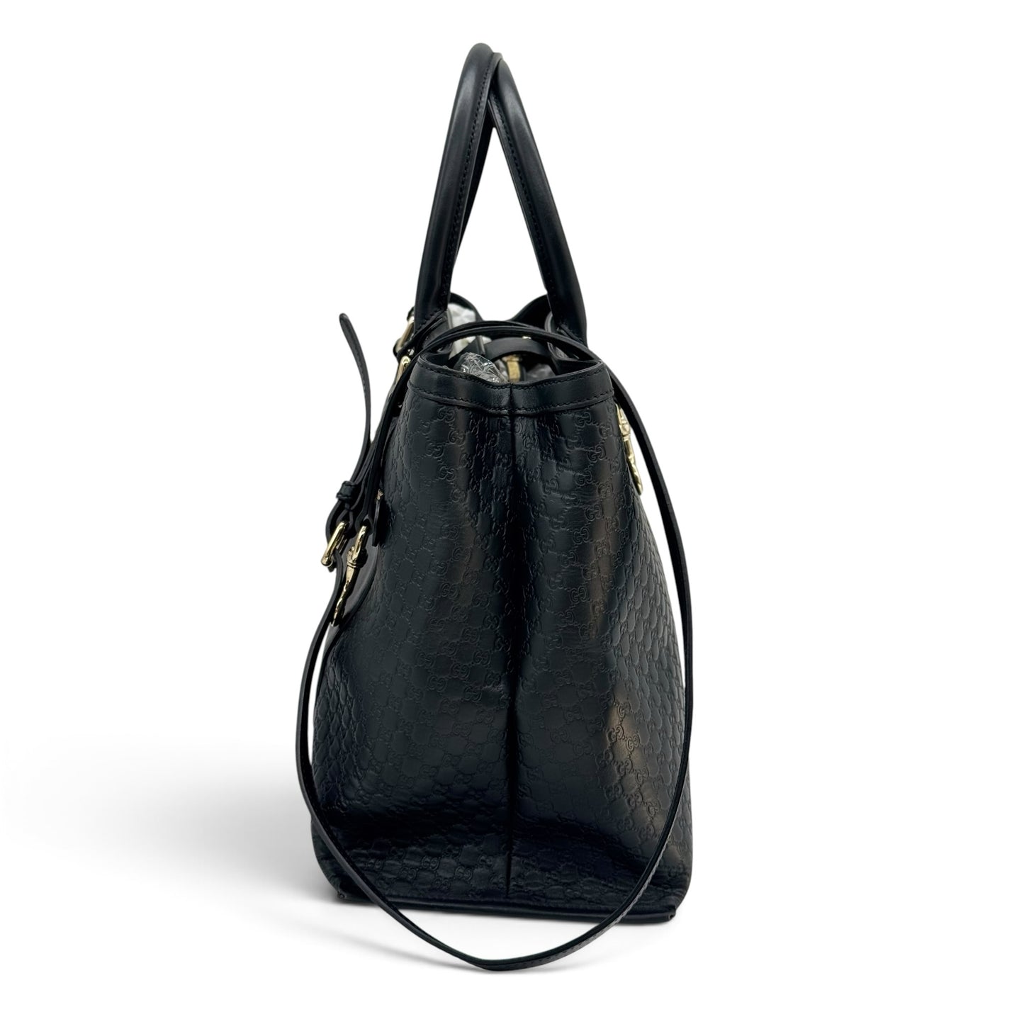 Borsa tote Borse Vintage Gucci in pelle nera con motivo GG impresso, vista laterale con manici e tracolla