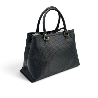 Borsa tote Borse Vintage Gucci in pelle nera con motivo GG impresso e dettagli in metallo dorato