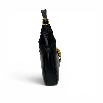 Borsa a spalla Borse Vintage Gucci Jackie 1961 in pelle nera liscia con chiusura a pistone dorata, vista laterale.