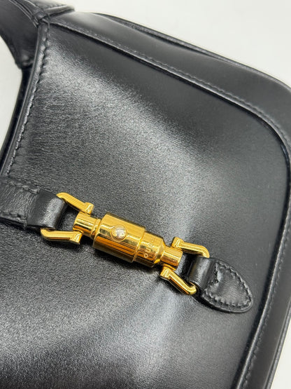 Borsa a spalla Borse Vintage Gucci Jackie 1961 in pelle nera con iconica chiusura a pistone in metallo dorato