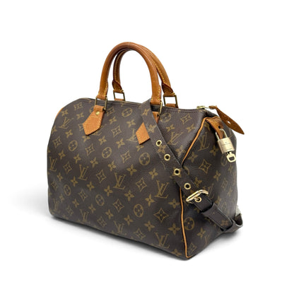 Borsa a mano Borse Vintage Louis Vuitton Speedy in tela Monogram con tracolla, manici in pelle e lucchetto dorato.