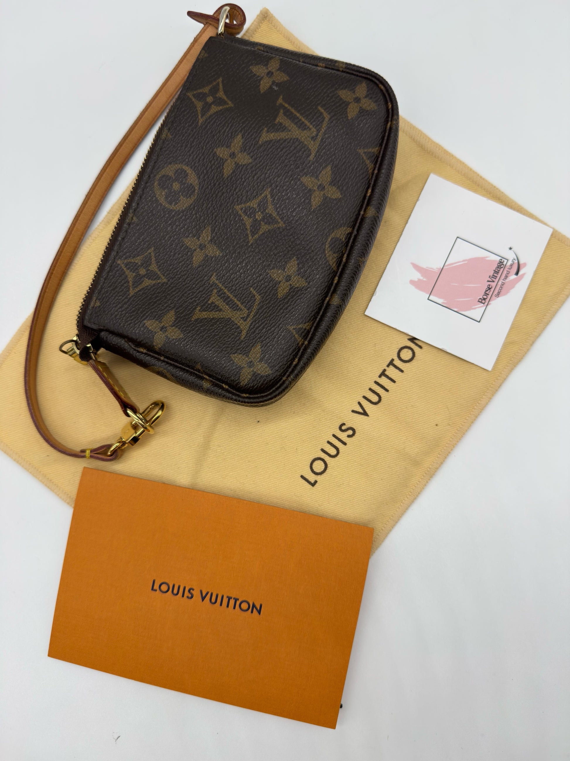 Pochette Accessoires Borse Vintage in tela Monogram marrone con finiture in vacchetta e dettagli dorati