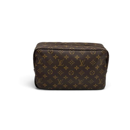 Pochette Louis Vuitton in tela Monogram marrone con motivo iconico e dettagli dorati, proposta da Borse Vintage.