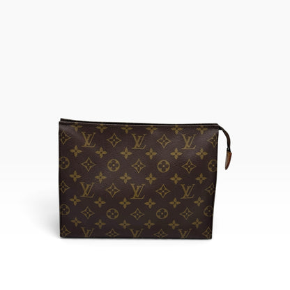 Pochette Toilette Louis Vuitton in tela Monogram marrone con chiusura a zip, proposta da Borse Vintage.