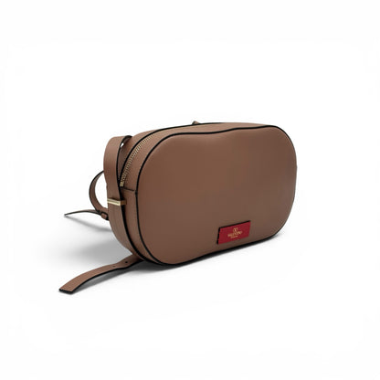 Borsa a tracolla Borse Vintage Valentino Garavani in pelle color nude con forma ovale e logo dorato su etichetta rossa